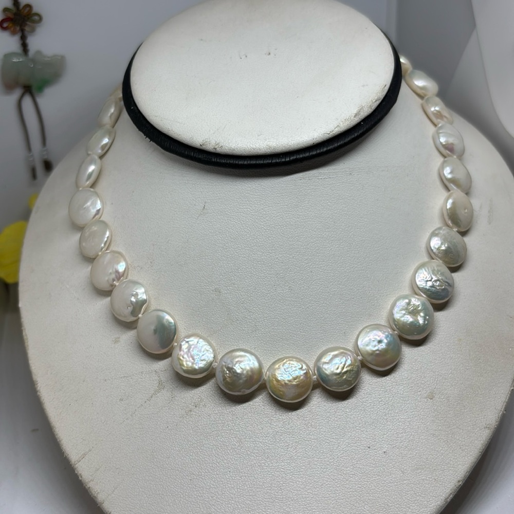 14mm cultured freshwater coin pearl necklace.  With a big sterling silver clasp
